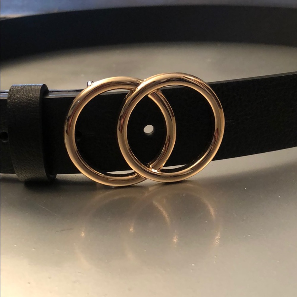 Gold buckle “Gucci” belt